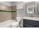 Bathroom with a tub, a mirrored vanity, and updated fixtures at 840 E Baylor Ln, Chandler, AZ 85225