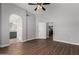 Primary bedroom featuring arched doorway with adjoining bath and kitchen views at 840 E Baylor Ln, Chandler, AZ 85225