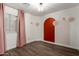 Stylish bedroom with wood floors, decorative wall accents, and bright window with pink curtains at 840 E Baylor Ln, Chandler, AZ 85225
