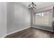 Cozy dining area with modern light fixture and a large window at 840 E Baylor Ln, Chandler, AZ 85225