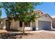 Inviting single-story home featuring a well-manicured lawn and a two-car garage at 840 E Baylor Ln, Chandler, AZ 85225