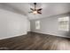 Open-concept living room with neutral paint, wood floors, and ample natural light at 840 E Baylor Ln, Chandler, AZ 85225