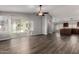 Spacious open floor plan with wood flooring and a sliding glass door to the backyard at 840 E Baylor Ln, Chandler, AZ 85225