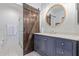 Modern bathroom featuring a barn door, stylish vanity, and glass-enclosed shower at 9450 E Becker Ln # 1046, Scottsdale, AZ 85260
