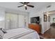 Bedroom featuring a ceiling fan, balcony access, and wood floors at 9450 E Becker Ln # 1046, Scottsdale, AZ 85260