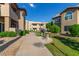 Apartment complex featuring landscaped grounds with a barbeque grill at 9450 E Becker Ln # 1046, Scottsdale, AZ 85260