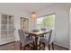 Charming dining area with a wooden table, comfortable chairs, and a natural light fixture at 9450 E Becker Ln # 1046, Scottsdale, AZ 85260