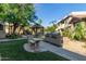 Community grilling area with well-maintained landscaping, offering residents a pleasant outdoor cooking space at 9450 E Becker Ln # 1046, Scottsdale, AZ 85260