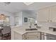Open kitchen with white countertops, stainless steel appliances, and eat-in dining area at 9450 E Becker Ln # 1046, Scottsdale, AZ 85260