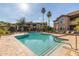 Community pool with lounge chairs and landscaping at 9450 E Becker Ln # 1046, Scottsdale, AZ 85260