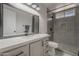 Updated bathroom featuring a white vanity, quartz countertop and a modern tiled walk-in shower at 10101 N 91St Ave # 111, Peoria, AZ 85345