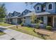 Attractive townhouse with blue siding,dormer windows, and lush green lawn at 10101 N 91St Ave # 111, Peoria, AZ 85345