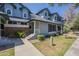 Inviting two-story townhouse with blue siding, brick accents, and well-maintained landscaping at 10101 N 91St Ave # 111, Peoria, AZ 85345