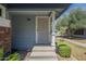 Charming front porch with a secure screen door and manicured landscaping at 10101 N 91St Ave # 111, Peoria, AZ 85345