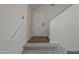 Hallway with white front door, staircase and neutral decor at 10101 N 91St Ave # 111, Peoria, AZ 85345