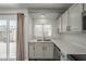 Bright kitchen featuring granite countertops, white cabinets, and stainless steel appliances at 10101 N 91St Ave # 111, Peoria, AZ 85345