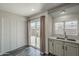 Bright kitchen featuring granite countertops, white cabinets, stainless steel appliances, and backyard access at 10101 N 91St Ave # 111, Peoria, AZ 85345