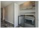 Well-equipped laundry room with modern washer and dryer at 10101 N 91St Ave # 111, Peoria, AZ 85345