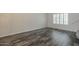 Bright living room showcasing hardwood floors and plantation shutters at 10101 N 91St Ave # 111, Peoria, AZ 85345