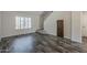 Light-filled living room featuring hardwood floors and a bright window at 10101 N 91St Ave # 111, Peoria, AZ 85345