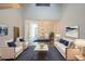 Stylishly furnished living room with high ceilings and an open-concept design at 10101 N 91St Ave # 111, Peoria, AZ 85345