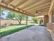 A spacious covered patio overlooks a well-manicured backyard and block wall at 13810 N 39Th Ave, Phoenix, AZ 85053