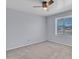 A bright bedroom with a ceiling fan and window allowing natural light to illuminate the room at 13810 N 39Th Ave, Phoenix, AZ 85053