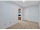 Carpeted bedroom featuring two bright white doors and light blue walls at 13810 N 39Th Ave, Phoenix, AZ 85053