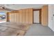 Well-organized garage features built-in storage, ample space, and access to a side door for convenience and functionality at 13810 N 39Th Ave, Phoenix, AZ 85053
