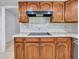 Kitchen features wood cabinets, tile floors, and ample counter space at 13810 N 39Th Ave, Phoenix, AZ 85053