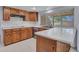 Kitchen features wood cabinets, tile floors, and ample counter space at 13810 N 39Th Ave, Phoenix, AZ 85053