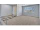 Spacious living room featuring tile entrance, plush carpet, and large window, providing ample natural light at 13810 N 39Th Ave, Phoenix, AZ 85053
