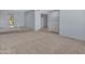 Bright living room features carpeted floors, staircase, and neutral paint at 13810 N 39Th Ave, Phoenix, AZ 85053