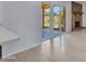 Bright living room features tile floors, slider doors, and neutral paint at 13810 N 39Th Ave, Phoenix, AZ 85053
