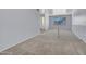 Bright living room features carpeted floors, staircase, and neutral paint at 13810 N 39Th Ave, Phoenix, AZ 85053
