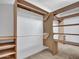 Walk-in closet with custom storage and shelving at 13810 N 39Th Ave, Phoenix, AZ 85053