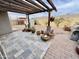 Covered patio with various potted plants and seating area at 14345 N 101St St, Scottsdale, AZ 85260