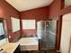 Bathroom featuring a glass enclosed shower and soaking tub at 14345 N 101St St, Scottsdale, AZ 85260