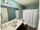 Bathroom with an over-sized vanity and shower with tub combo at 14345 N 101St St, Scottsdale, AZ 85260