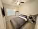 Relaxing bedroom with a ceiling fan at 14345 N 101St St, Scottsdale, AZ 85260