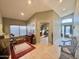 Spacious foyer boasting tile flooring and views into the well-lit living areas at 14345 N 101St St, Scottsdale, AZ 85260
