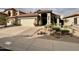 Beautiful single-Gathering home boasting meticulous desert landscaping and a spacious driveway at 14345 N 101St St, Scottsdale, AZ 85260