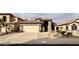 Charming single-Gathering home with a tile roof, desert landscaping, and a two-car garage at 14345 N 101St St, Scottsdale, AZ 85260