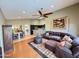 View of open concept living area, with kitchen bar, leather sectional sofa, and dining table at 14345 N 101St St, Scottsdale, AZ 85260