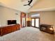 Bright living room featuring a ceiling fan and access to the outside at 14345 N 101St St, Scottsdale, AZ 85260