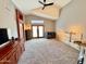 Spacious living area boasts a vaulted ceiling and doors leading to a patio at 14345 N 101St St, Scottsdale, AZ 85260