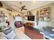 Inviting office featuring a ceiling fan, a TV, and a versatile workspace for productivity at 14345 N 101St St, Scottsdale, AZ 85260