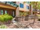 Charming two-story exterior with brick accents, lush greenery, and a private entrance at 16 W Encanto Blvd # 26, Phoenix, AZ 85004