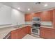 Well-lit kitchen with stainless appliances and ample counter space at 16 W Encanto Blvd # 26, Phoenix, AZ 85004