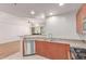 Modern kitchen with granite countertops adjacent to the living room at 16 W Encanto Blvd # 26, Phoenix, AZ 85004